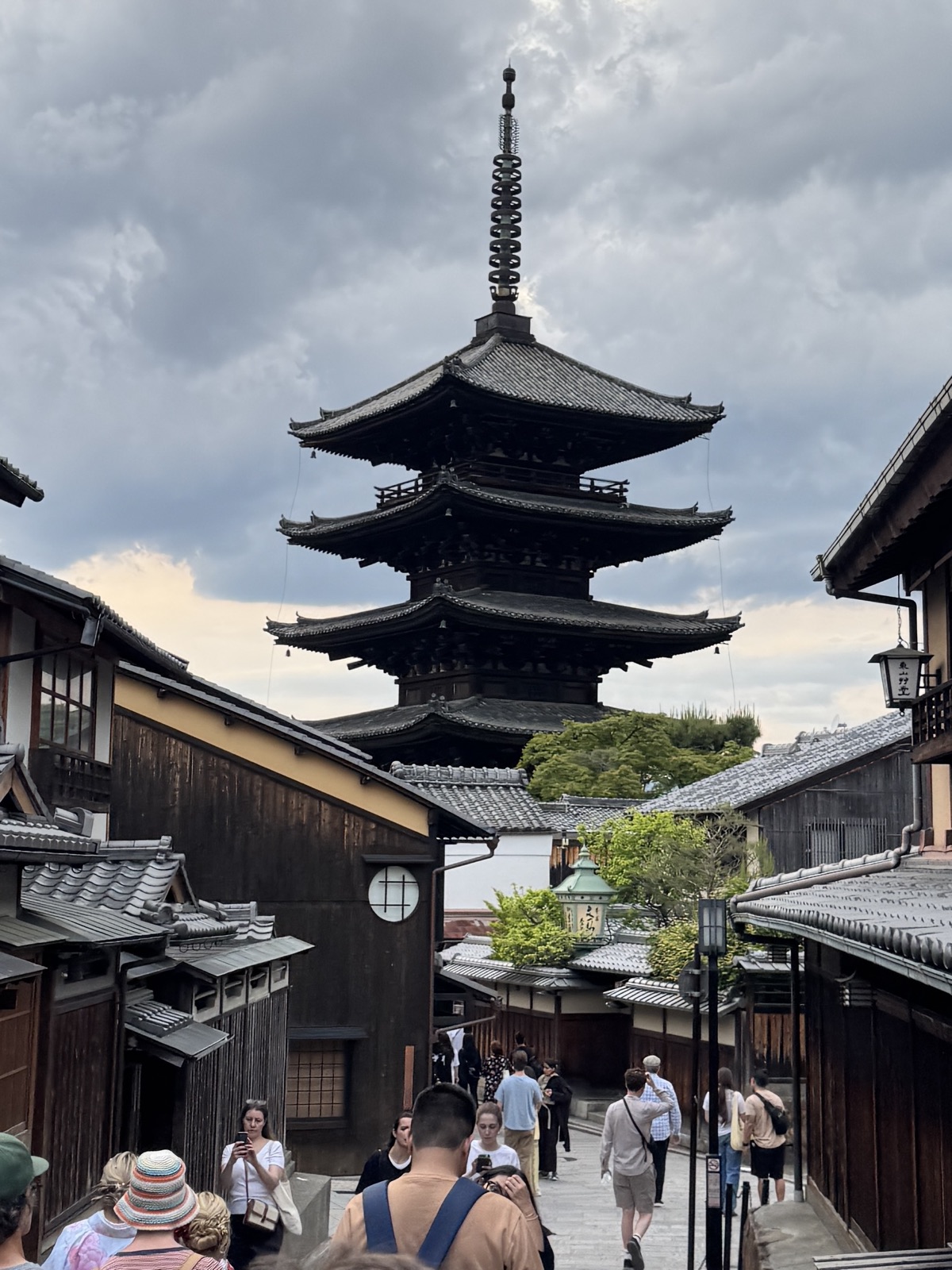 Yasaka Pagoda in Higashiyama, Kyoto — wooden machiya rooftops and late-afternoon visitors