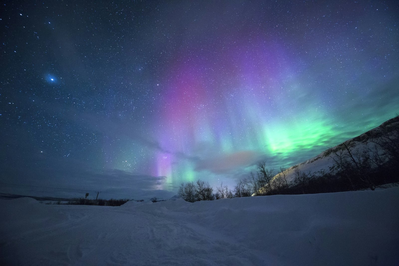 Aurora borealis over an Icelandic landscape at night